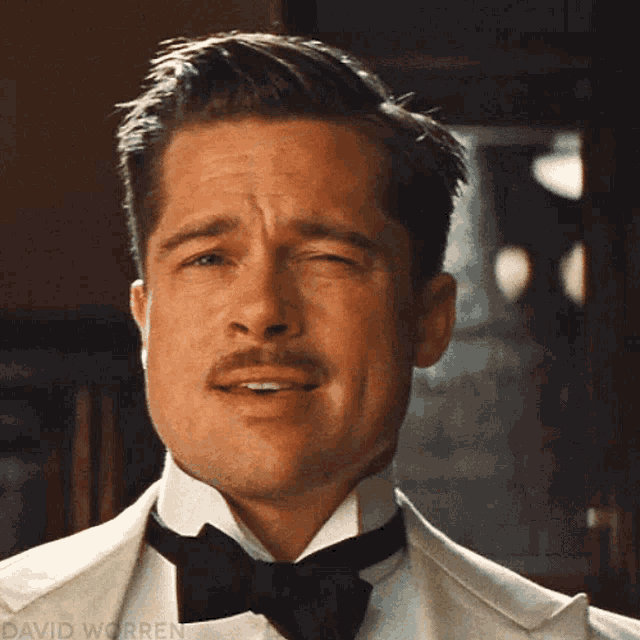 a close up of a man 's face with the name david worren visible's face with the name david worren visible